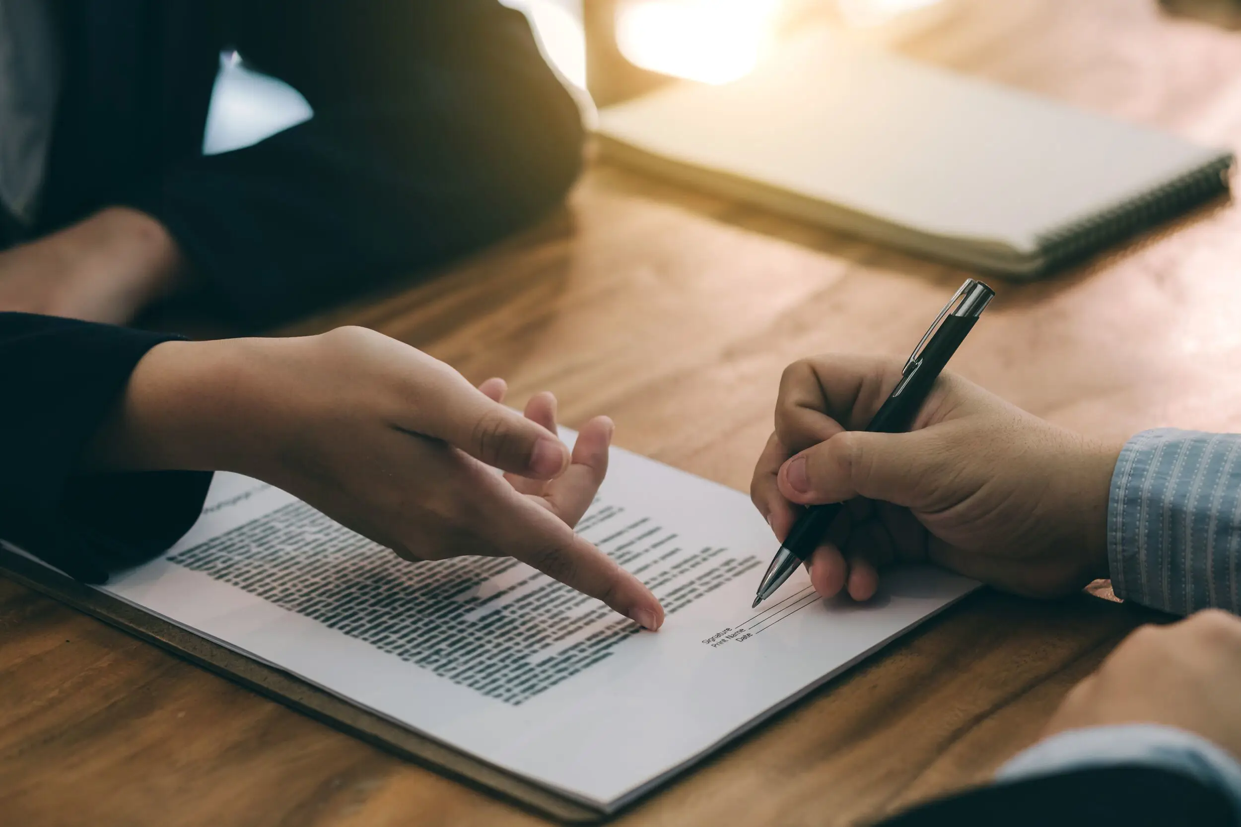 Signing a contract.