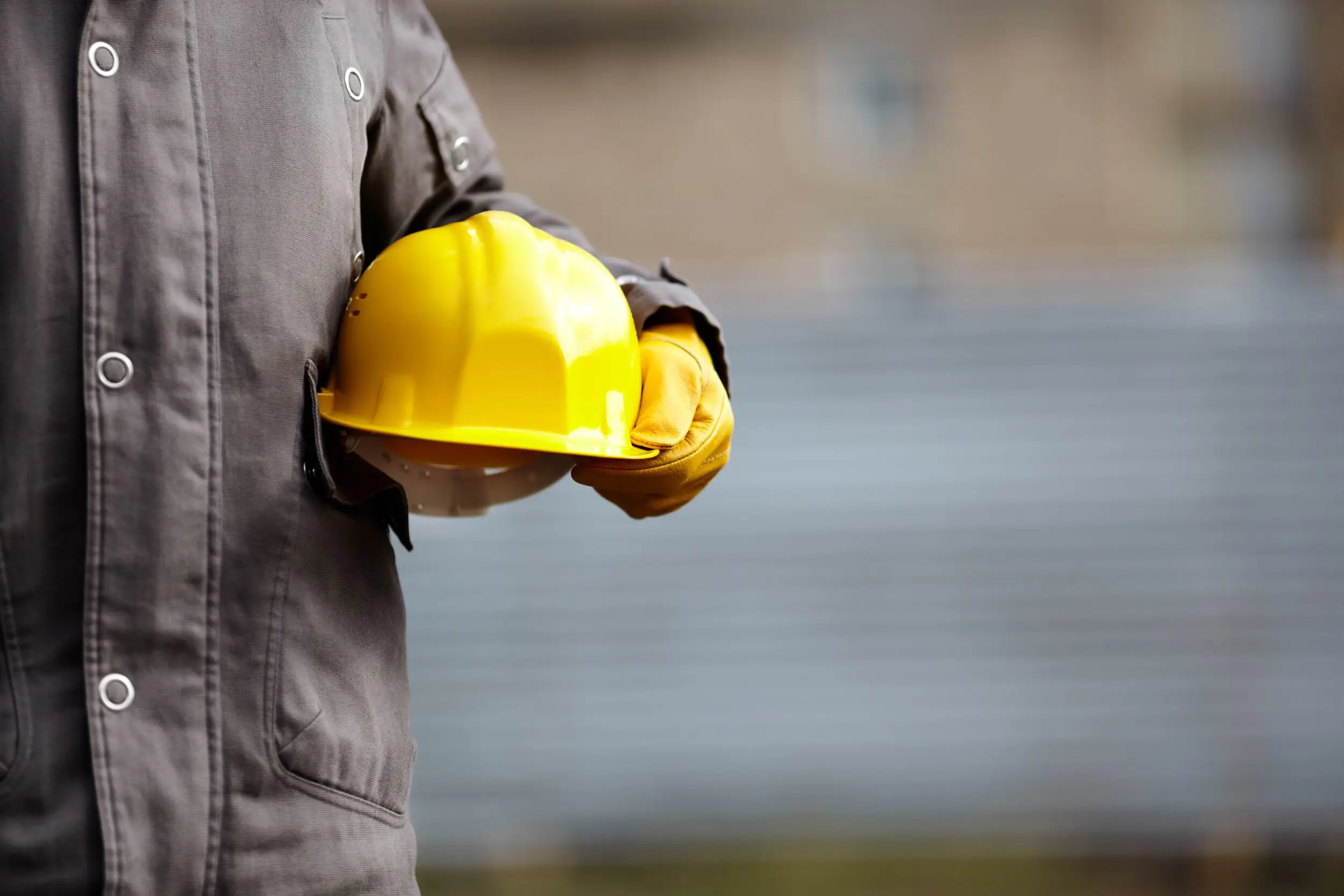 Man holding a hardhat.